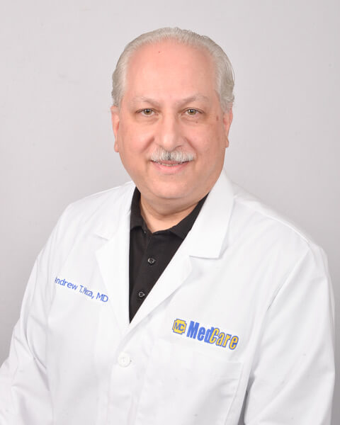 Male Doctor of MedCare in Gray Background