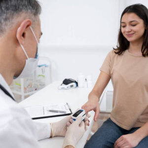 Male Doctor Taking Temperature of a Female Patient
