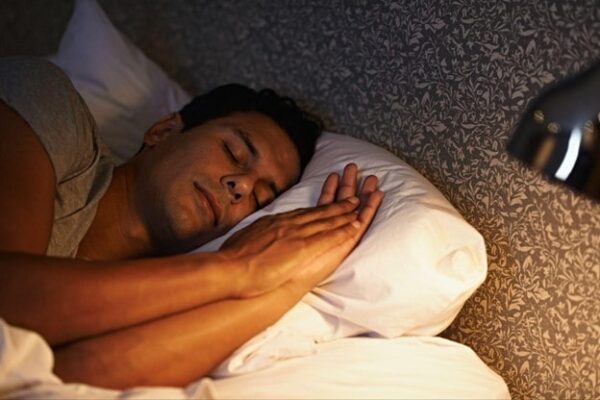 Sleeping man in bed